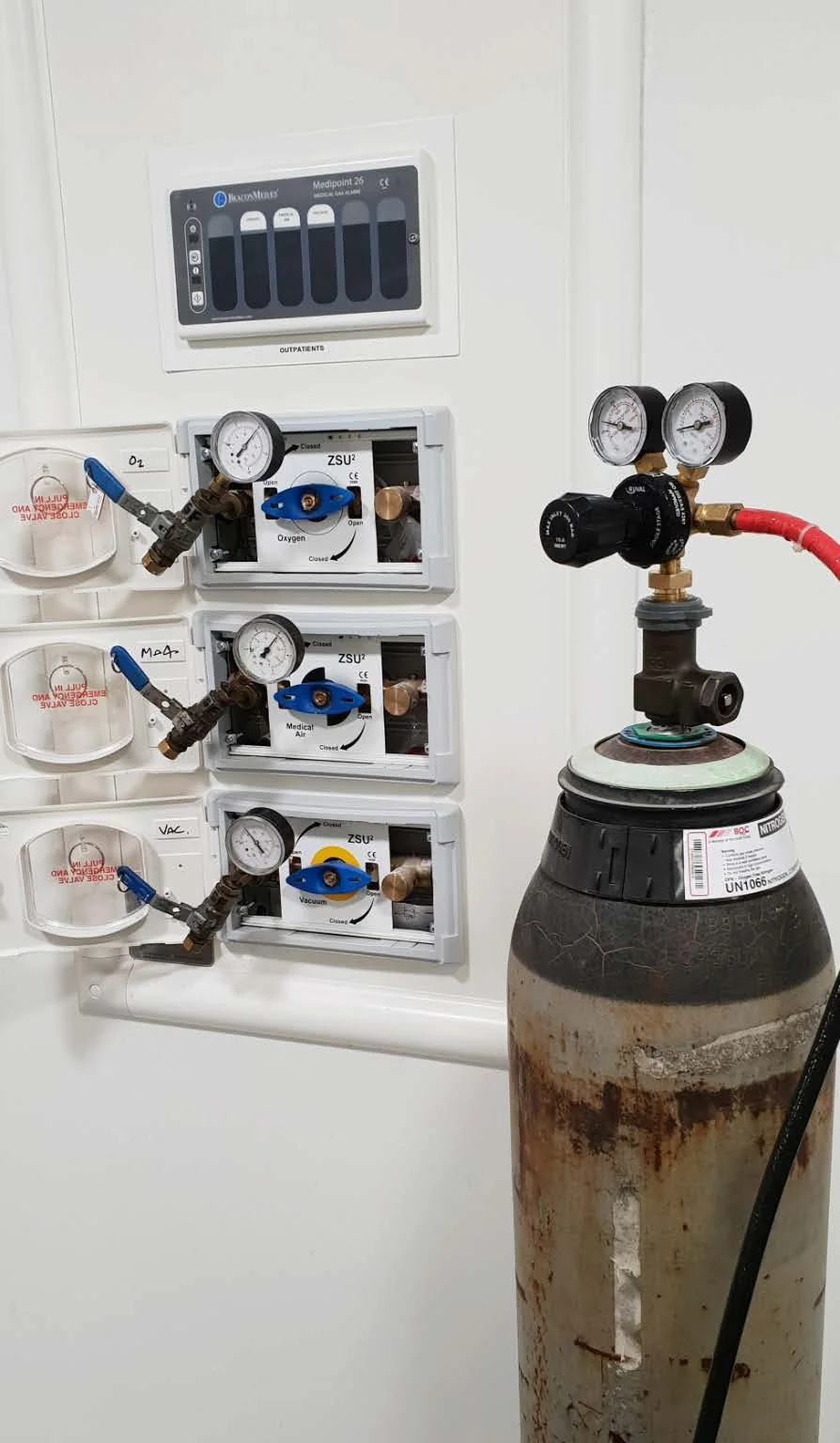 Cylinder with regulator beside wall-mounted terminal units